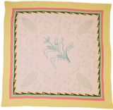 Decorative blanket with a central design of a bird and corn stalks, framed by a yellow border.