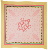 Pink turtle design on a yellow background with corn patterns