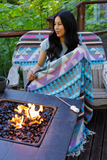 woman next to a campfire with marshmallows