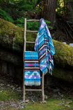 blanket ladder with blankets on it