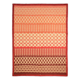 A rectangular woven textile with horizontal bands of geometric patterns in red, orange, and cream, finished with a red fringed border.
