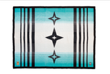 A rectangular woven textile with a Southwestern geometric pattern, featuring turquoise, white, and black stripes with star motifs, shown flat against a white background.