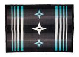 A rectangular woven textile with a Southwestern-inspired geometric pattern, featuring black, gray, white, and turquoise stripes with star and vertical stripe motifs.