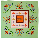 Decorative blanket with geometric patterns on a green background