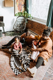 Family lounging in a living room.