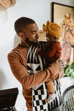 Man holding a toddler.